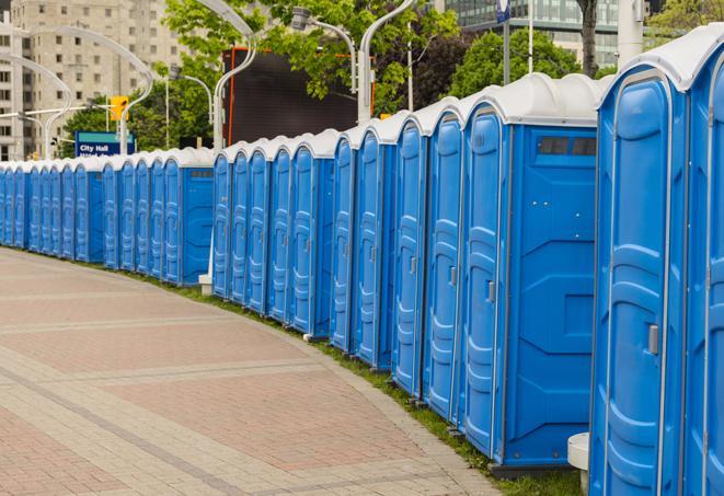 a row of portable restrooms set up for a special event, providing guests with a comfortable and sanitary option in Harvard